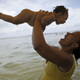 Rosana Vieira Alves holds her 4-month-old daughter Luana Vieira, who was born with microcephaly.
